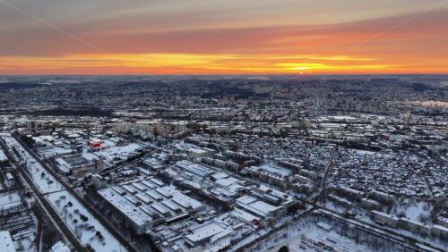 Video - Aerial drone view of Chisinau city covered in snow at sunset. Winter in Moldova