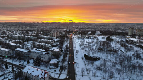 Video - Aerial drone view of Chisinau city covered in snow at sunset. Winter in Moldova