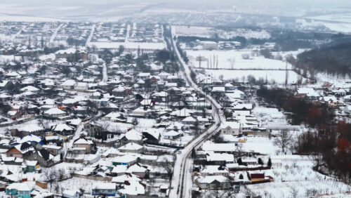 Video - Aerial drone view of Butuceni village covered in snow. Old Orhei during winter in Moldova