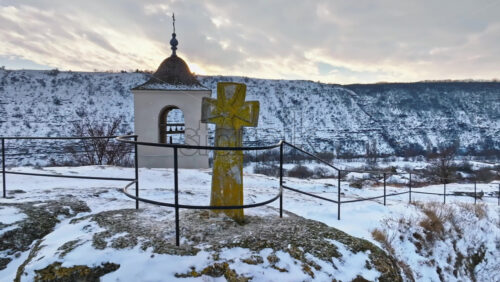 Video - Aerial drone view of the old stone cross located on a view point in Old Orhei at sunset, Moldova