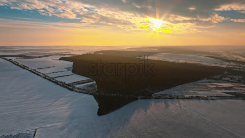 Video - Aerial drone view of the Old Orhei covered in snow at sunrise. Fields during winter in Moldova