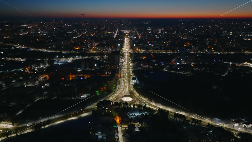 Video - Aerial drone view of Chisinau city covered in snow in the night. Blue hour during winter in Moldova