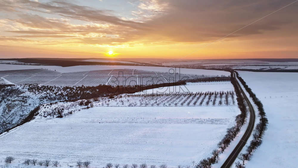 Video - Aerial drone view of the Old Orhei covered in snow at sunrise. Fields during winter in Moldova