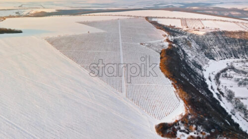 Video - Aerial drone view of the Old Orhei covered in snow at sunrise. Fields during winter in Moldova