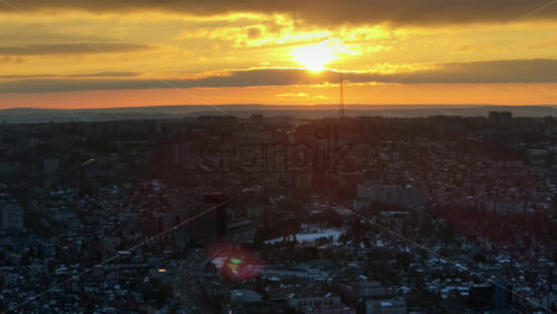 Video - Aerial drone view of Chisinau city covered in snow at sunset. Winter in Moldova