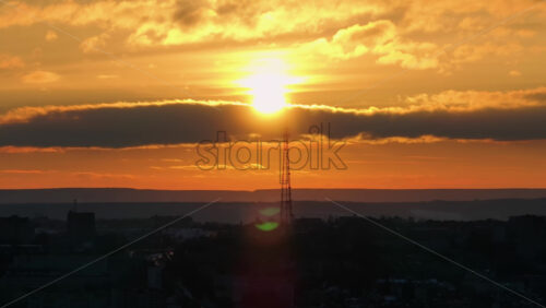 Video - Aerial drone view of Chisinau city at sunset. Radio transmission tower in background. Moldova