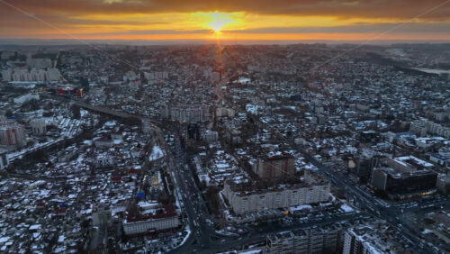 Video - Aerial drone view of Chisinau city covered in snow at sunset. Winter in Moldova