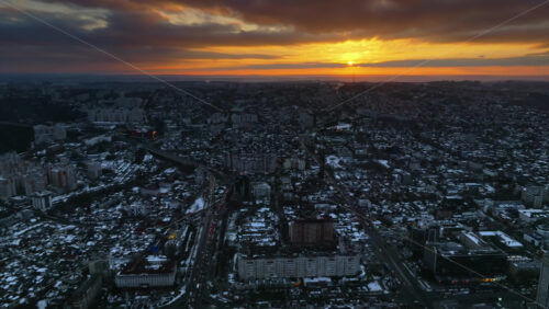 Video - Aerial drone view of Chisinau city covered in snow at sunset. Winter in Moldova