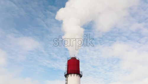 Video - Aerial drone view of a working thermal power station. Steam and smoke coming from pipes