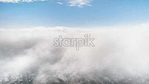 Video - Aerial drone view of Chisinau city covered in snow. Clear sky with clouds and bright sun. Winter in Moldova