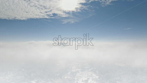 Video - Aerial drone view of Chisinau city covered in snow. Clear sky with clouds and bright sun. Winter in Moldova