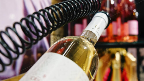 Video - CRICOVA, MOLDOVA - APRIL 6, 2021: White wine bottle on a specific stand in the winery
