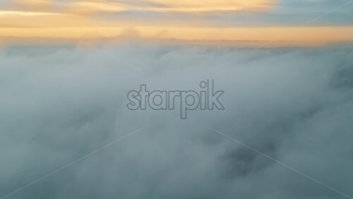 Video - Aerial drone view above the clouds with buildings visible through, Chisinau, Moldova