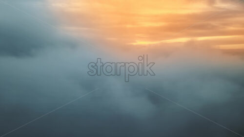 Video - Aerial drone view above the clouds, sunlight