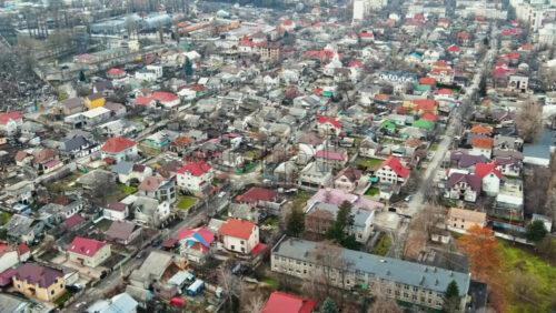 Video - Aerial drone view of Chisinau. Panorama view of a residential district with multiple buildings, roads and bare trees. Good weather. Moldova