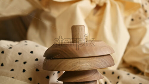 Video - Little girl's hands playing with a wooden stacking jug. Ecological and sustainability concept