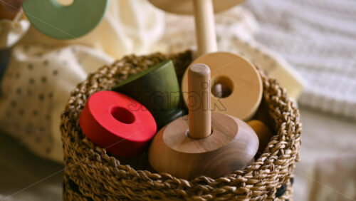 Video - Two little girls put wooden toys in the basket. Ecological and sustainability concept