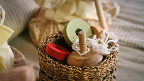 Video - Two little girls taking wooden toys from the basket. Ecological and sustainability concept