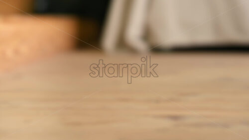 Video - Little girl playing with a wooden snail rolling toy on the floor. Ecological and sustainability concept