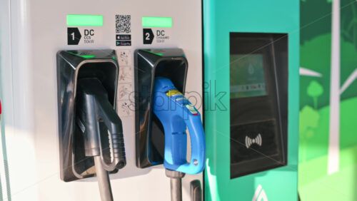 Video - Electric car charger with two plugged in pistols