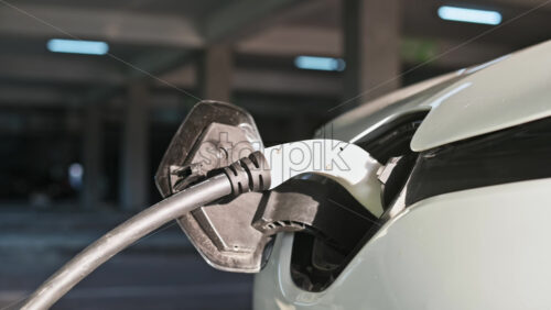 Video - Plugged charger into an white electric car