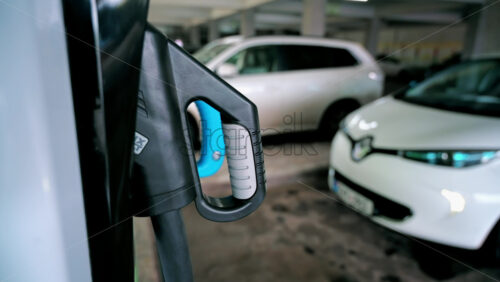 Video - CHISINAU, MOLDOVA - APRIL 26, 2021: Man parking Renault Zoe electric car and starting charging it