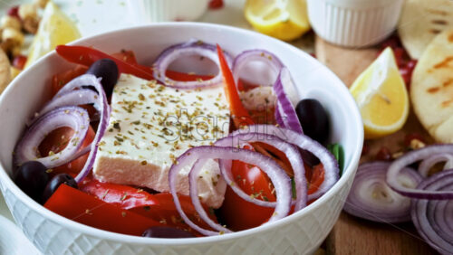Video - Close-up view of a table full of healthy national food in dishes. Sliced vegetables, salads and appetizers