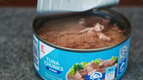 Video - CHISINAU, MOLDOVA - JANUARY 6, 2020: Opened can with tuna chunks on a kitchen table