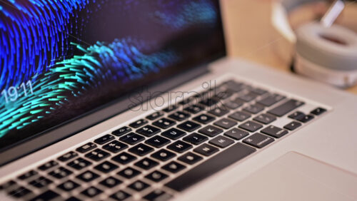 Video - Laptop, headphones and microphone on wooden table. Content creator tools