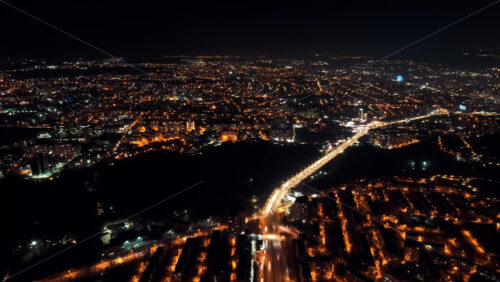 Video - Aerial drone hyperlapse timelapse of moving cars in the city at night. Chisinau, Moldova