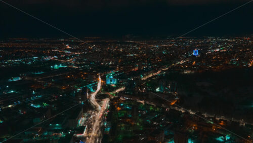 Video - Aerial drone hyperlapse timelapse of moving cars in the city at night. Chisinau, Moldova