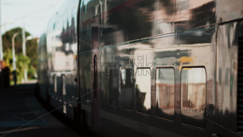 Video - Close up of a train moving on the rails near a station in France