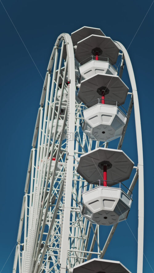 Video - Close up of people in a cabin in a Ferris Wheel with the blue sky on the background. Vertical