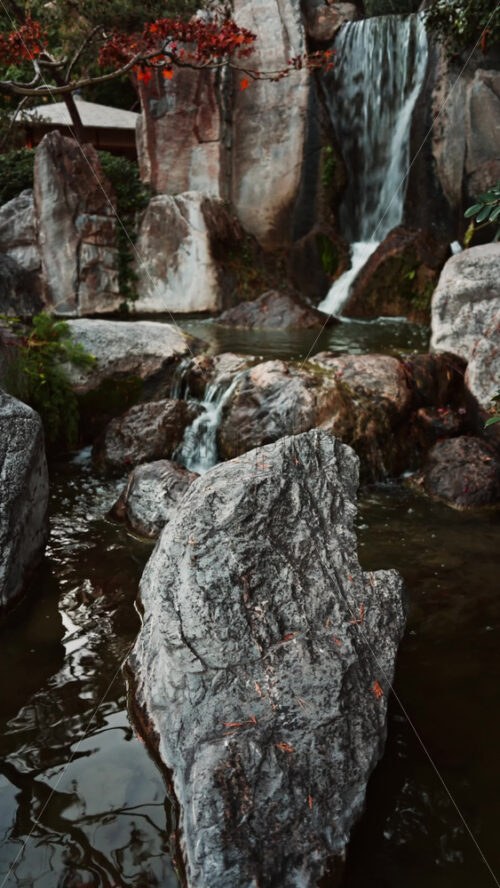 Video - View of the a small waterfall in the Japanese Gardens in Monaco. Vertical
