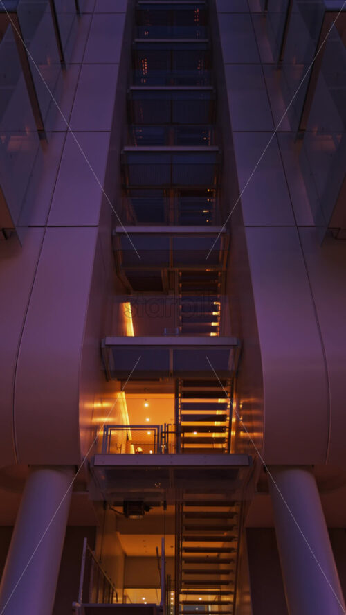 Video - Close up of a building in the Mareterra new Residential district in Monaco in the evening. Vertical