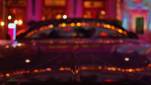 Video - Blurred view of a car parked in the courtyard of the Monte Carlo Casino in the evening in Monaco