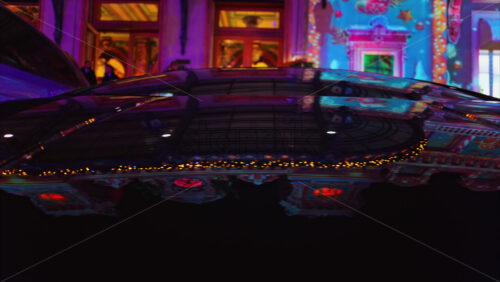 Video - Close up of a black car parked in the courtyard of the Monte Carlo Casino in the evening in Monaco