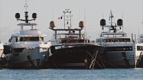 Video - View of a man working on a boat docked in the Port de Cannes in France