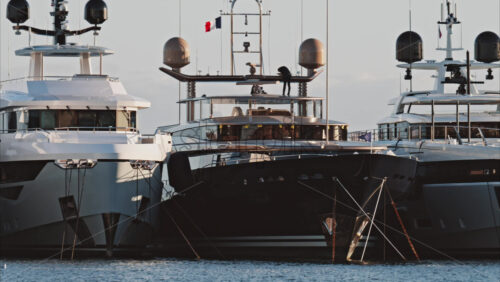 Video - View of a man working on a boat docked in the Port de Cannes in France