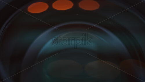 Video - Close up of a camera lens on a wooden table