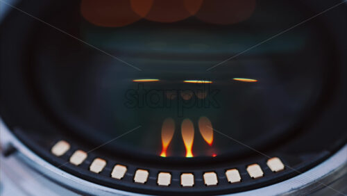 Video - Close up of a camera lens on a wooden table