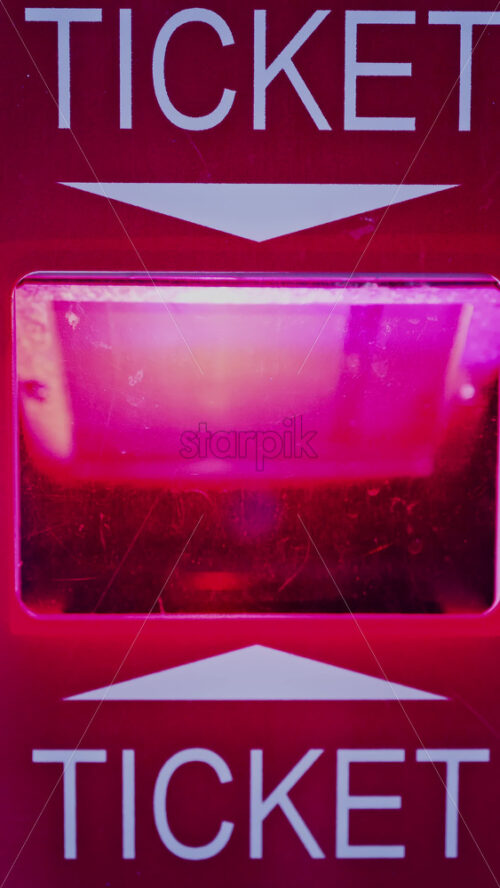 Video - Close up of a red ticket output with flashing lights