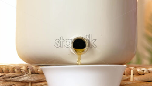 Video - Woman recycling organic waste by draining Bokashi liquid in the kitchen