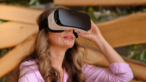 Video - Woman enjoying looking through VR headset