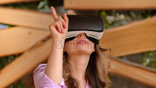 Video - Woman enjoying looking through VR headset