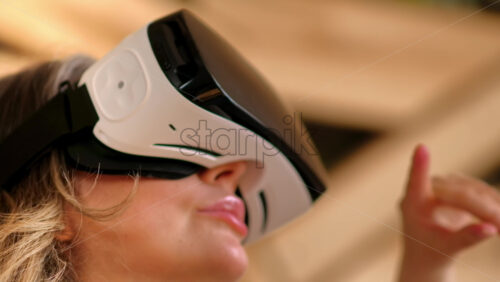 Video - Woman enjoying looking through VR headset