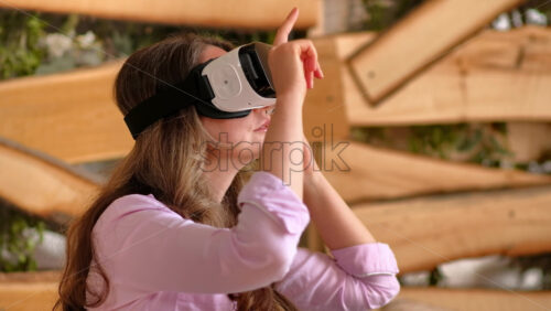 Video - Woman enjoying looking through VR headset