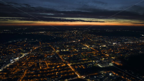 Video - Aerial drone hyperlapse timelapse of Chisinau city covered in snow at night, blue hour. Winter in Moldova