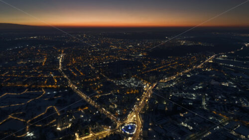 Video - Aerial drone hyperlapse timelapse of Chisinau city covered in snow at night. Winter in Moldova