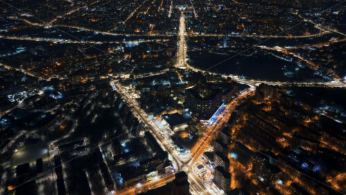 Video - Aerial drone hyperlapse timelapse of Chisinau city covered in snow at night. Winter in Moldova